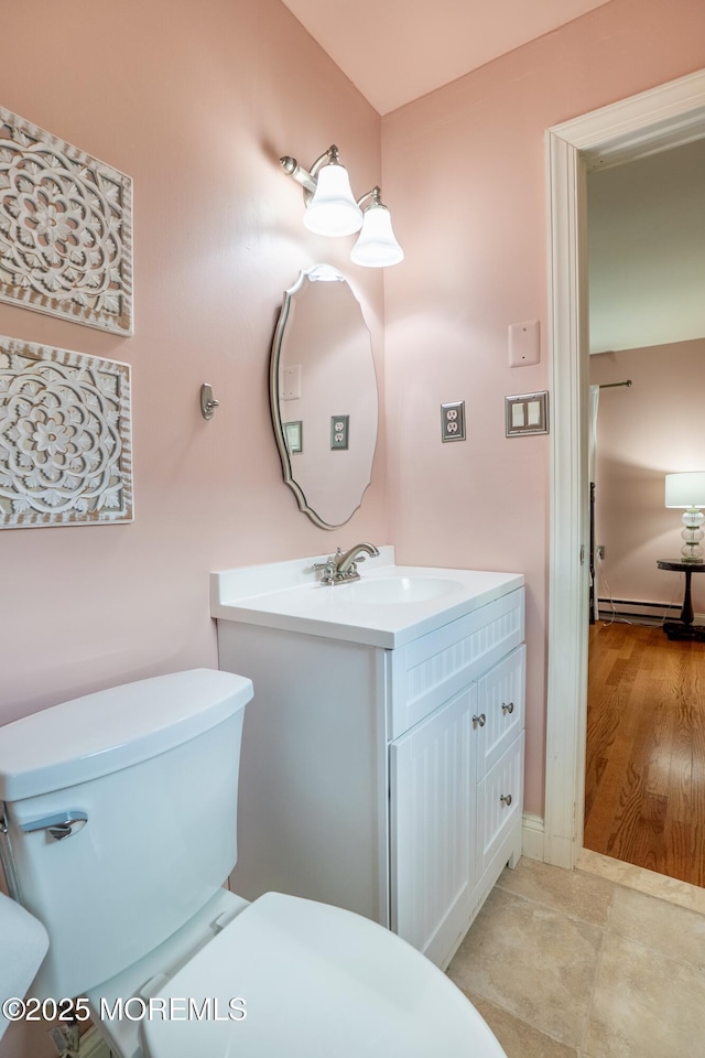 98 Everest S, Brick, NJ 08724 - half bath featuring a baseboard radiator and vanity