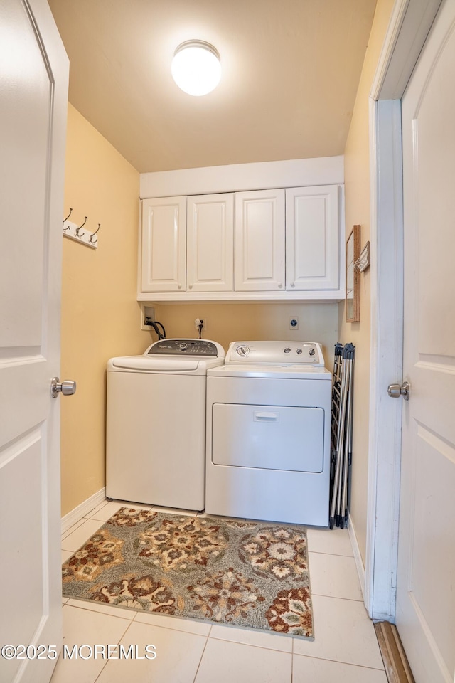 98 Everest S, Brick, NJ 08724 - washroom featuring cabinet space, washing machine and dryer, and light tile patterned flooring