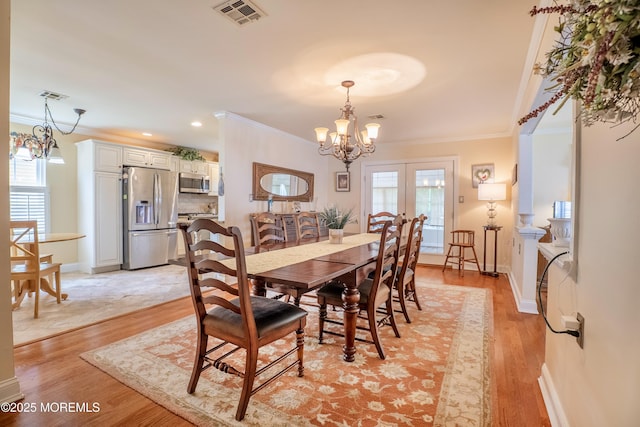 98 Everest S, Brick, NJ 08724 - dining space with a chandelier, crown molding, light wood-style floors, and recessed lighting