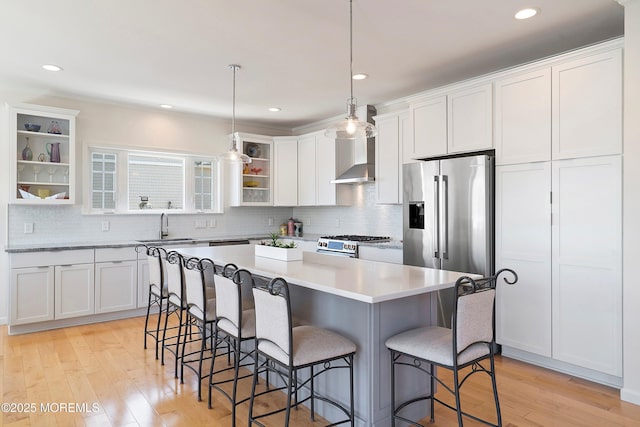 1735 Certainty Dr, Point Pleasant, NJ 08742 - kitchen with high end appliances, open shelves, a breakfast bar, white cabinets, and a center island