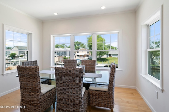1735 Certainty Dr, Point Pleasant, NJ 08742 - dining space featuring light wood finished floors, plenty of natural light, ornamental molding, and recessed lighting