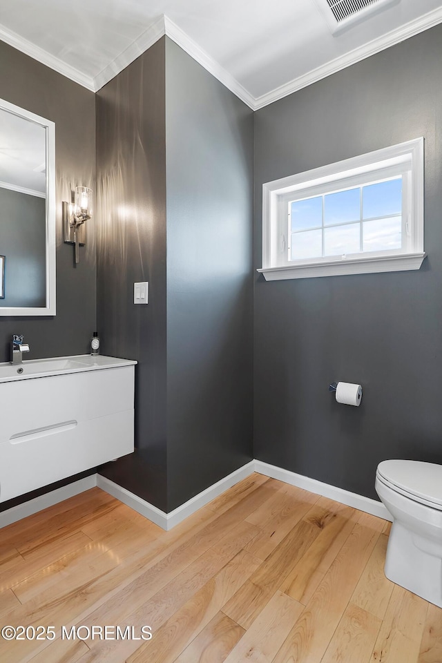 1735 Certainty Dr, Point Pleasant, NJ 08742 - bathroom featuring wood finished floors, vanity, and ornamental molding