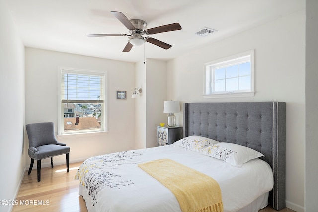 1735 Certainty Dr, Point Pleasant, NJ 08742 - bedroom featuring multiple windows, light wood finished floors, and a ceiling fan