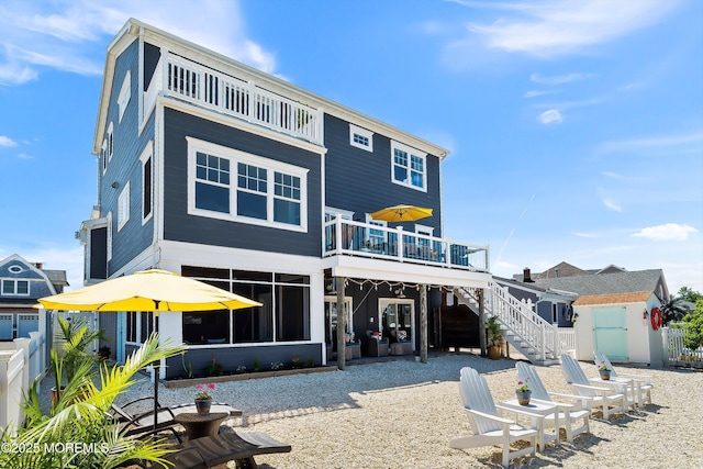 1735 Certainty Dr, Point Pleasant, NJ 08742 - rear view of house featuring stairway and a balcony