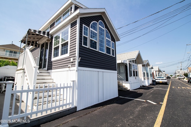 37 15th Ave, Seaside Park, NJ 08752 - view of property exterior featuring entry steps and uncovered parking