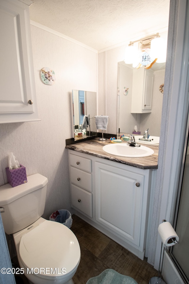 37 15th Ave, Seaside Park, NJ 08752 - bathroom with vanity, a textured ceiling, wood finished floors, and ornamental molding