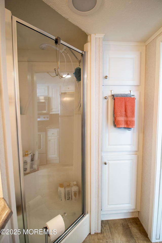 37 15th Ave, Seaside Park, NJ 08752 - full bathroom with a stall shower and wood finished floors