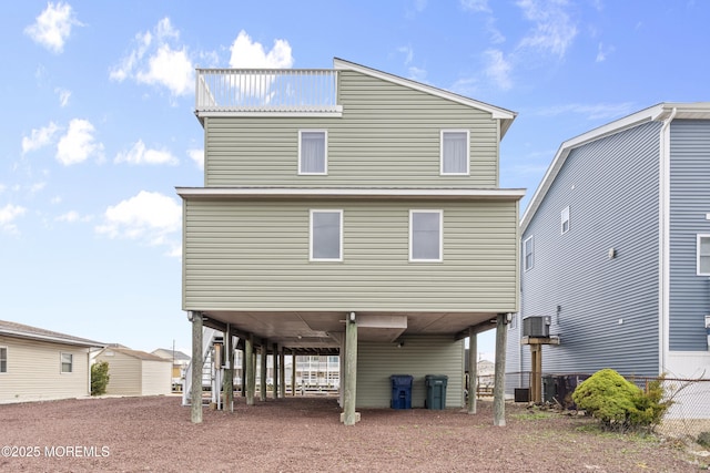 4 W Shrewsbury Dr, Little Egg Harbor, NJ 08087 - back of house featuring a carport and dirt driveway