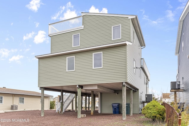 4 W Shrewsbury Dr, Little Egg Harbor, NJ 08087 - rear view of house featuring a carport and stairs