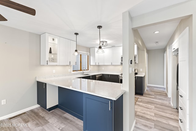 4 W Shrewsbury Dr, Little Egg Harbor, NJ 08087 - kitchen featuring light wood-style floors, white cabinets, a peninsula, recessed lighting, and pendant lighting