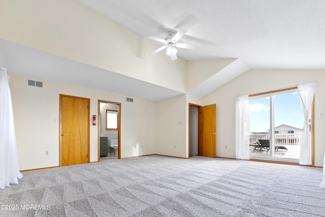 4 W Shrewsbury Dr, Little Egg Harbor, NJ 08087 - unfurnished bedroom with access to exterior, lofted ceiling, ensuite bath, carpet flooring, and ceiling fan