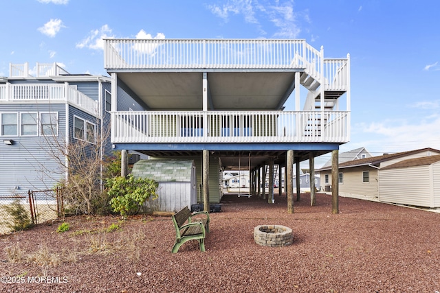 4 W Shrewsbury Dr, Little Egg Harbor, NJ 08087 - back of house with a carport, an outdoor fire pit, and a deck
