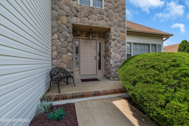 43 Winchester Dr, Howell, NJ 07731 - doorway to property with stone siding and a shingled roof