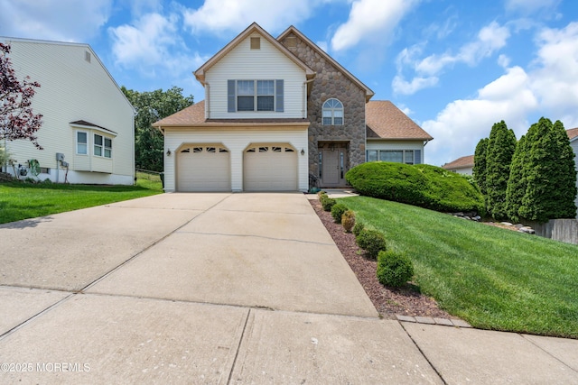 43 Winchester Dr, Howell, NJ 07731 - traditional-style house with concrete driveway, a front lawn, stone siding, and an attached garage