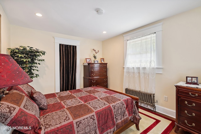 34 Sea View Ter, Highlands, NJ 07732 - bedroom with wood finished floors, recessed lighting, and radiator