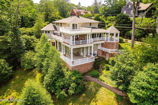 34 Sea View Ter, Highlands, NJ 07732 - rear view of property with a balcony and a shingled roof