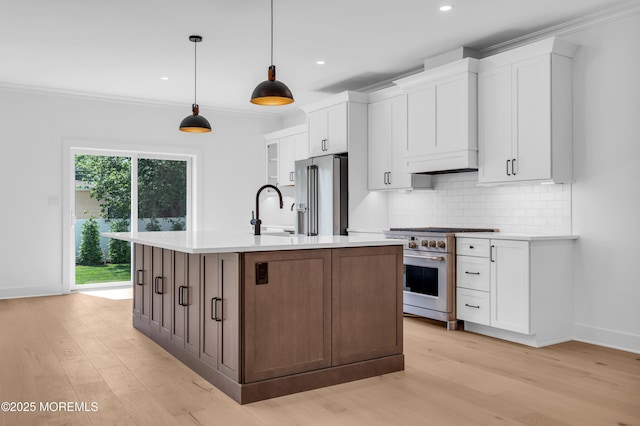 842 Arnold Ave Unit 4, Point Pleasant, NJ 08742 - kitchen with high quality appliances, white cabinets, light countertops, tasteful backsplash, and light wood finished floors