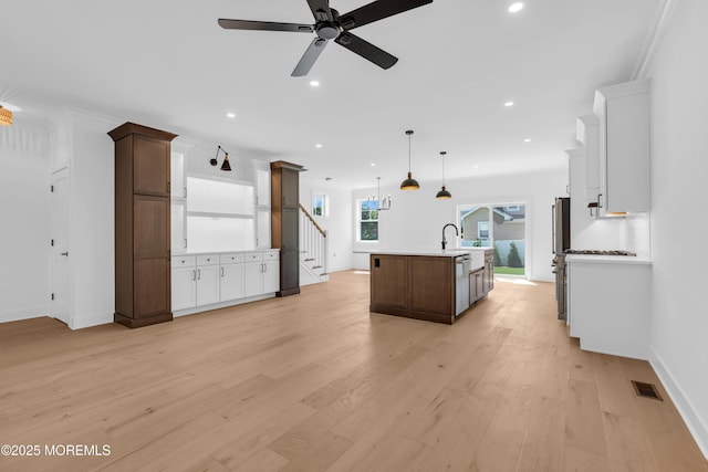 842 Arnold Ave Unit 4, Point Pleasant, NJ 08742 - kitchen with light countertops, ceiling fan, recessed lighting, light wood finished floors, and a kitchen island with sink