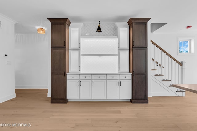 842 Arnold Ave Unit 4, Point Pleasant, NJ 08742 - kitchen featuring ornamental molding, light wood-style floors, and white cabinets