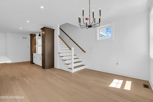 842 Arnold Ave Unit 4, Point Pleasant, NJ 08742 - unfurnished living room with ornamental molding, a chandelier, light wood finished floors, recessed lighting, and stairs
