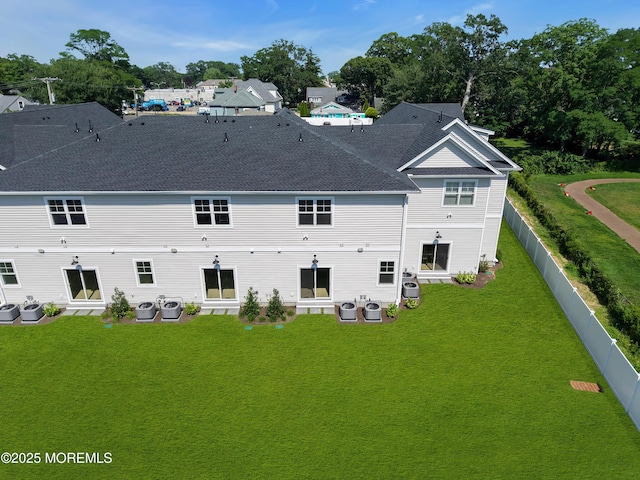 842 Arnold Ave Unit 4, Point Pleasant, NJ 08742 - rear view of house with a fenced backyard and roof with shingles