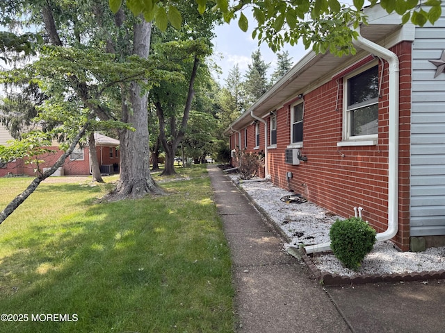 768D Hudson Pkwy, Whiting, NJ 08759 - view of side of home with a yard, brick siding, and cooling unit
