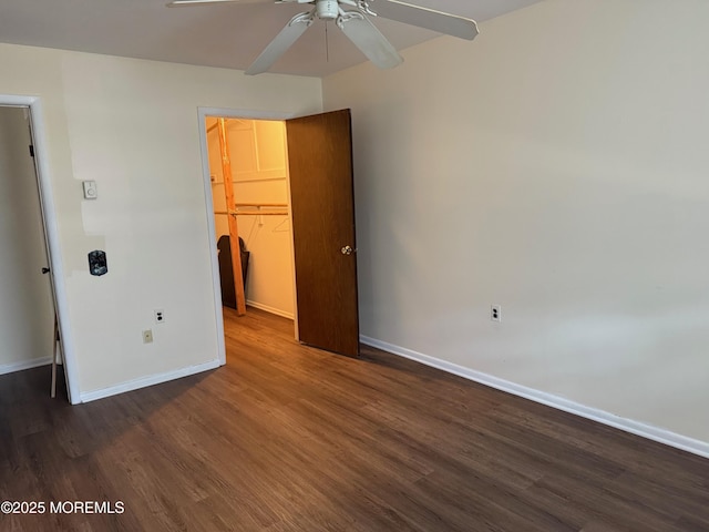 768D Hudson Pkwy, Whiting, NJ 08759 - unfurnished bedroom with a walk in closet, dark wood-style flooring, a closet, and a ceiling fan