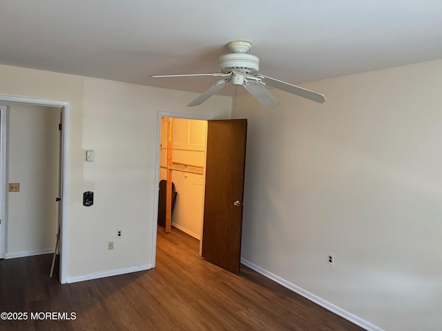 768D Hudson Pkwy, Whiting, NJ 08759 - unfurnished bedroom featuring a walk in closet, dark wood finished floors, a closet, and a ceiling fan