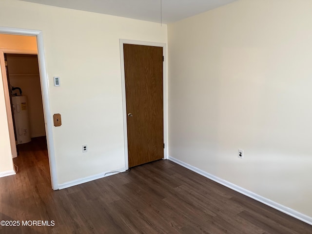768D Hudson Pkwy, Whiting, NJ 08759 - unfurnished bedroom featuring water heater, dark wood-style flooring, and a closet