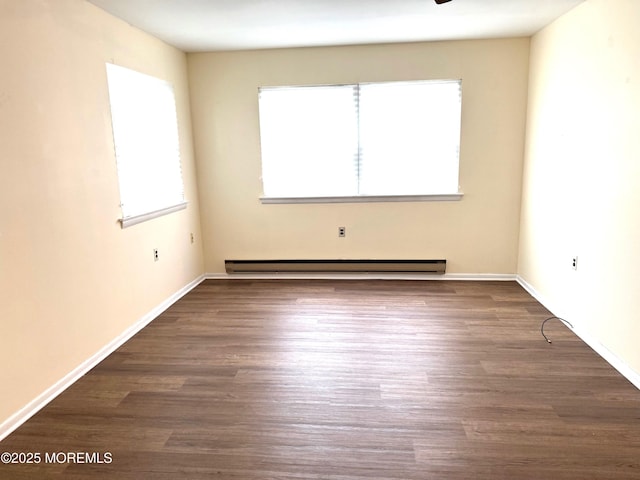 768D Hudson Pkwy, Whiting, NJ 08759 - spare room featuring a baseboard heating unit and dark wood-style floors