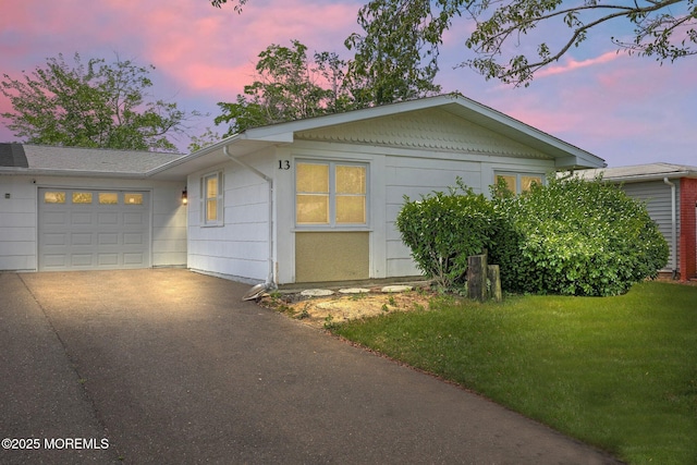 13 Brooke Rd, Brick, NJ 08724 - view of front of property with asphalt driveway, an attached garage, and a lawn