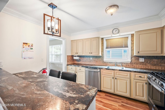 13 Brooke Rd, Brick, NJ 08724 - kitchen featuring appliances with stainless steel finishes, cream cabinetry, a chandelier, light wood-type flooring, and crown molding