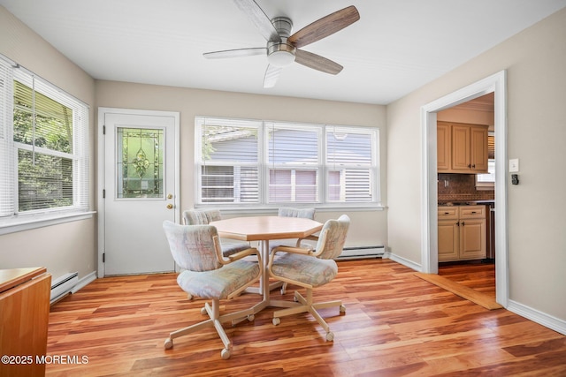 13 Brooke Rd, Brick, NJ 08724 - dining space featuring a baseboard heating unit, light wood-style floors, and a ceiling fan