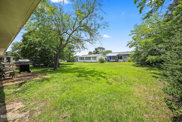 13 Brooke Rd, Brick, NJ 08724 - view of green lawn with a patio