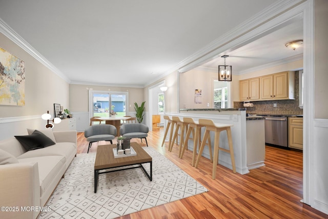 13 Brooke Rd, Brick, NJ 08724 - living room featuring light wood-style flooring, crown molding, and a chandelier