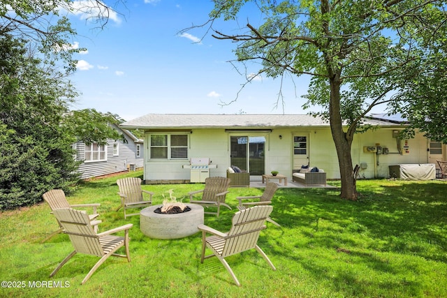 13 Brooke Rd, Brick, NJ 08724 - rear view of property featuring a lawn and an outdoor living space with a fire pit