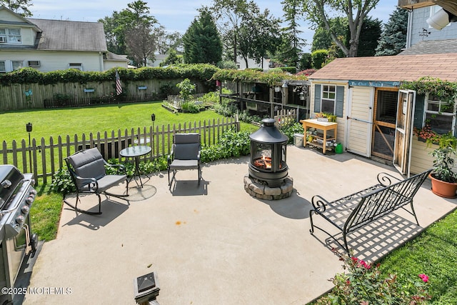 216 Main St, Port Monmouth, NJ 07758 - fenced backyard with an outdoor fire pit, a patio, and an outdoor structure