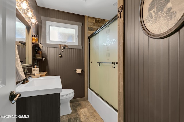 216 Main St, Port Monmouth, NJ 07758 - bathroom featuring vanity, enclosed tub / shower combo, and wood walls