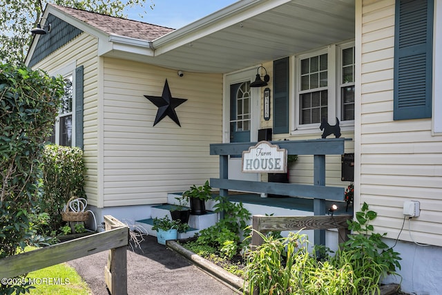 216 Main St, Port Monmouth, NJ 07758 - entrance to property with roof with shingles and covered porch