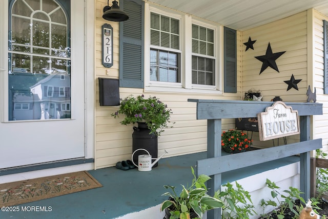 216 Main St, Port Monmouth, NJ 07758 - view of exterior entry featuring a porch