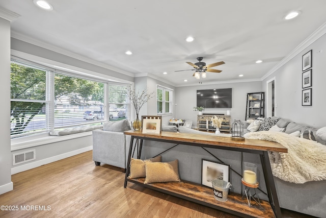 91 Newbury Rd, Howell, NJ 07731 - living area featuring recessed lighting, wood finished floors, a ceiling fan, ornamental molding, and a fireplace