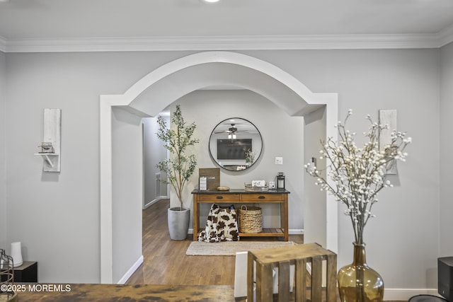 91 Newbury Rd, Howell, NJ 07731 - foyer entrance featuring arched walkways, wood finished floors, a ceiling fan, and ornamental molding