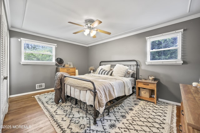 91 Newbury Rd, Howell, NJ 07731 - bedroom with wood finished floors, crown molding, and ceiling fan