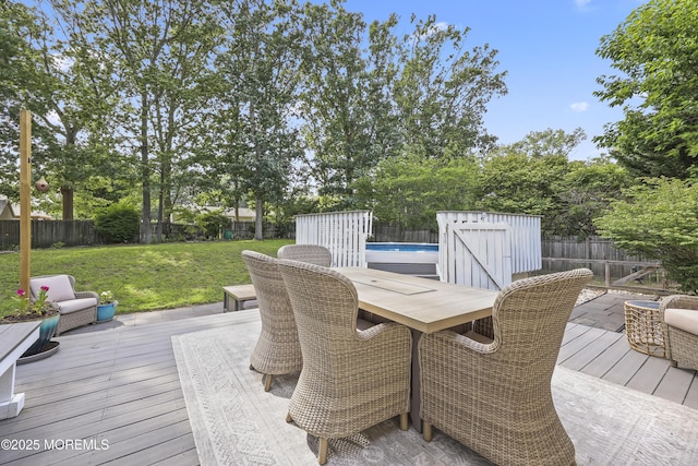 91 Newbury Rd, Howell, NJ 07731 - wooden terrace with outdoor dining space, a fenced backyard, and a storage shed