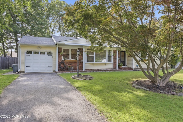 91 Newbury Rd, Howell, NJ 07731 - view of front facade featuring a garage, asphalt driveway, brick siding, and a shingled roof
