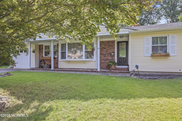 91 Newbury Rd, Howell, NJ 07731 - view of front of home featuring a front lawn, brick siding, an attached garage, and a porch