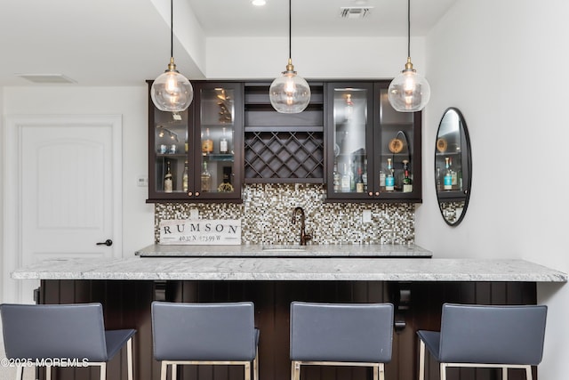 63 Bingham Ave, Rumson, NJ 07760 - indoor wet bar with tasteful backsplash and pendant lighting