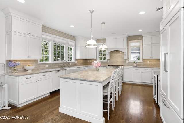 63 Bingham Ave, Rumson, NJ 07760 - kitchen featuring white dishwasher, a center island, white cabinetry, backsplash, and recessed lighting