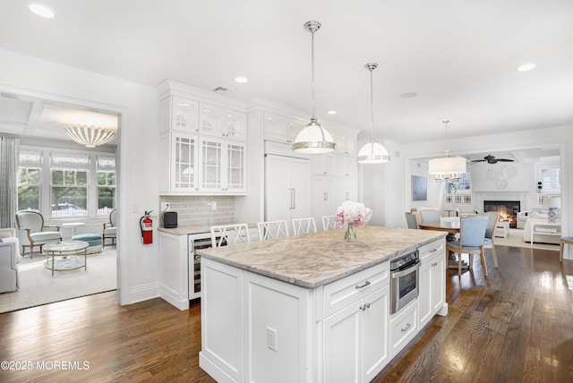 63 Bingham Ave, Rumson, NJ 07760 - kitchen with recessed lighting, dark wood-style flooring, decorative light fixtures, white cabinets, and wine cooler