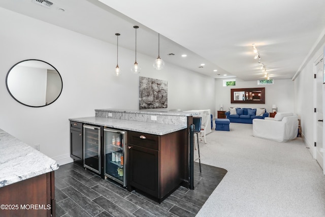 63 Bingham Ave, Rumson, NJ 07760 - bar area with beverage cooler, hanging light fixtures, recessed lighting, and rail lighting